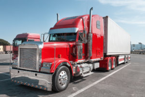 bright red truck in industrial yard